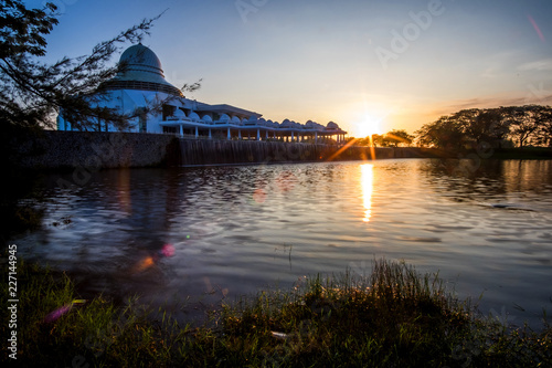 sunrise scnery at majestic floating mosque at seri iskandar,Malaysia. soft focus,blur due to long exposure. visible noise due to high ISO. photo