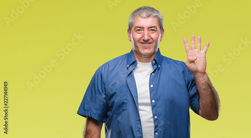 Handsome senior man over isolated background showing and pointing up with fingers number four while smiling confident and happy.
