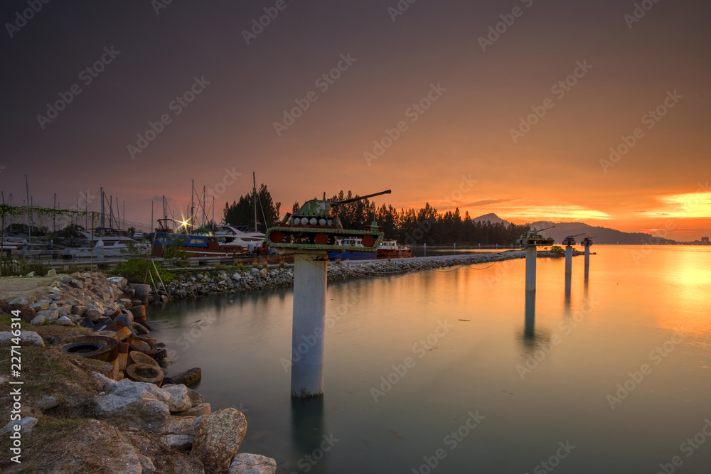 Sunset Scenery at Marina Islands Jetty,Perak,Malaysia With Clear Water.Soft Focus,Blur due to Long Exposure. Sunset Scenery at Marina Islands Jetty,Perak,Malaysia With Clear Water.Soft Focus,Blur due to Long Exposure.