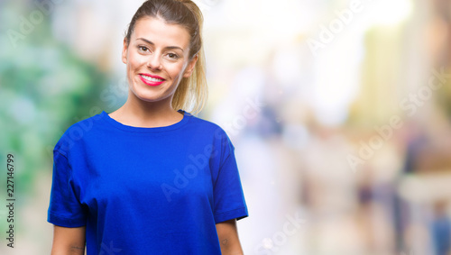 Young beautiful woman wearing casual blue t-shirt over isolated background with a happy and cool smile on face. Lucky person.