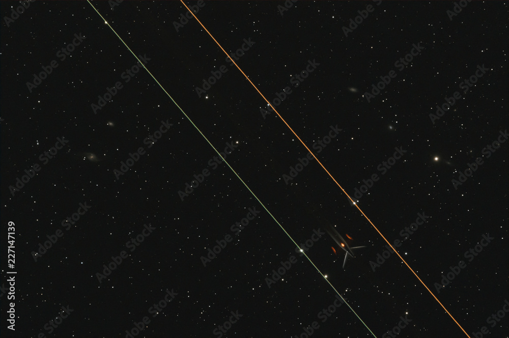 Fototapeta premium Poorly outlined planes parts against the background of the night sky and galaxies
