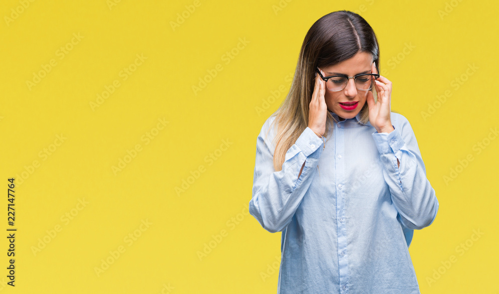 Young beautiful business woman wearing glasses over isolated background with hand on head for pain in head because stress. Suffering migraine. Young beautiful business woman wearing glasses over isolated background with hand on head for pain in head because stress. Suffering migraine.
