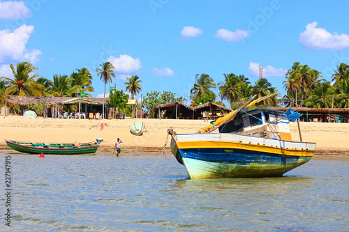 Barra Grande, Piauí, Brazil. Boats, shallow water, beach, rustic restaurants and palm trees.