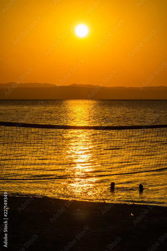 Fototapeta premium Early morning , dramatic sunrise over sea and mountain. Photographed in Asprovalta, Greece