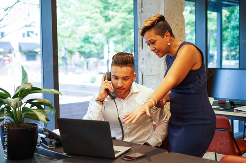 Colleagues working in office photo