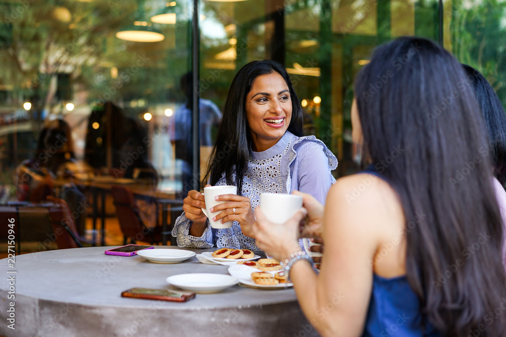 Businesswomen relaxing in cafe Businesswomen relaxing in cafe