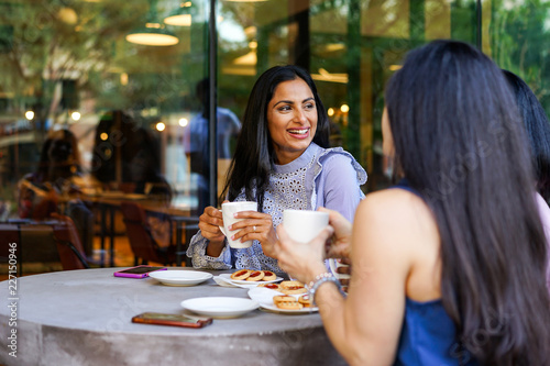 Businesswomen relaxing in cafe photo