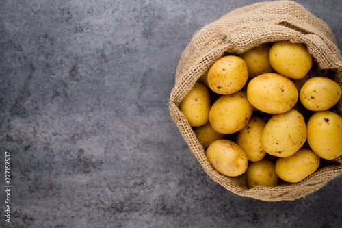A bio russet potato wooden vintage background.
