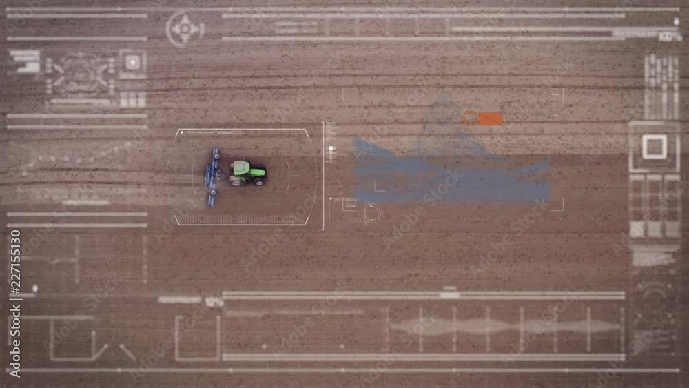 Aerial view from a futuristic machine while scanning a tractor working in the In fields. Aerial view from a futuristic machine while scanning a tractor working in the In fields.