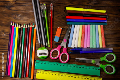 Set of school stationery supplies on wooden desk. Back to school concept