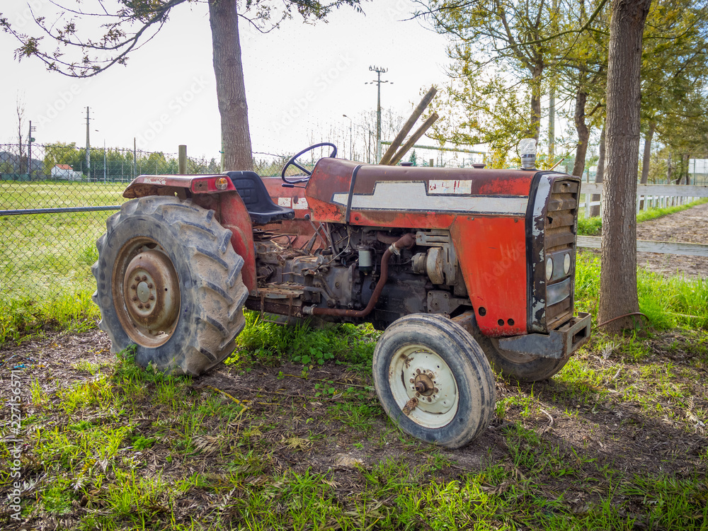 Old truck in a green farm in Portugal Old truck in a green farm in Portugal