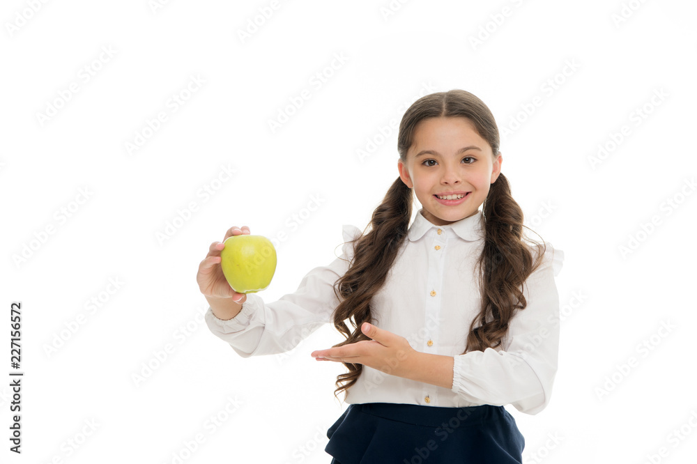 Girl cute long curly hair holds apple fruit white background. Child schoolgirl holds apple. Child kid happy face like apple. School snack concept. Healthy nutrition diet. Apple vitamin snack Girl cute long curly hair holds apple fruit white background. Child schoolgirl holds apple. Child kid happy face like apple. School snack concept. Healthy nutrition diet. Apple vitamin snack