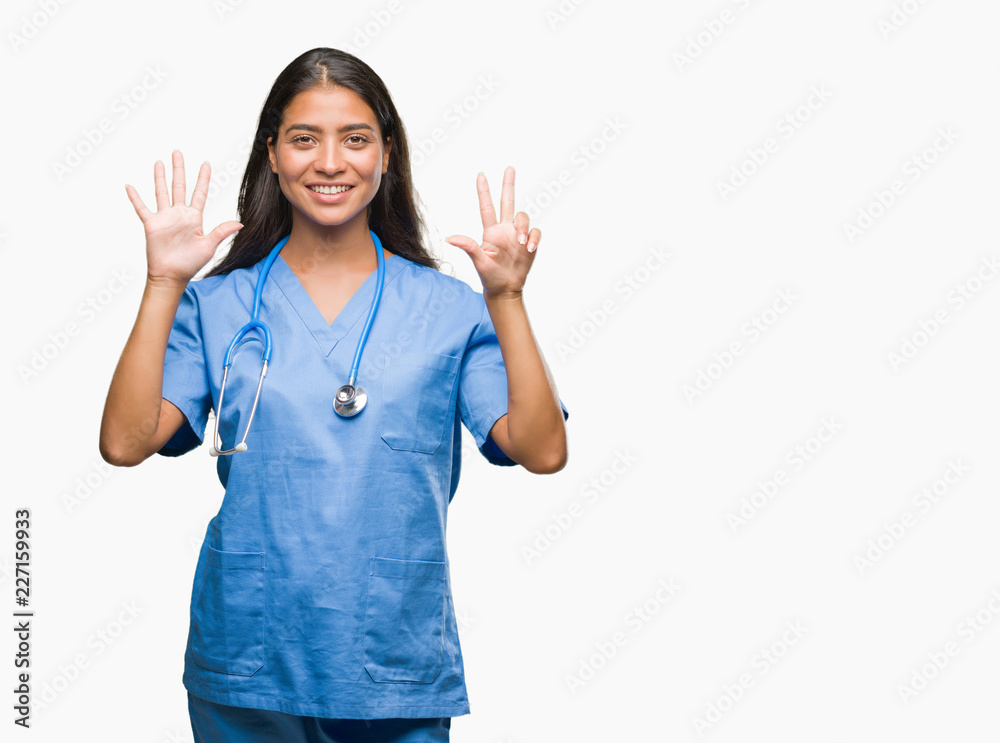 Young arab doctor surgeon woman over isolated background showing and pointing up with fingers number eight while smiling confident and happy. Young arab doctor surgeon woman over isolated background showing and pointing up with fingers number eight while smiling confident and happy.