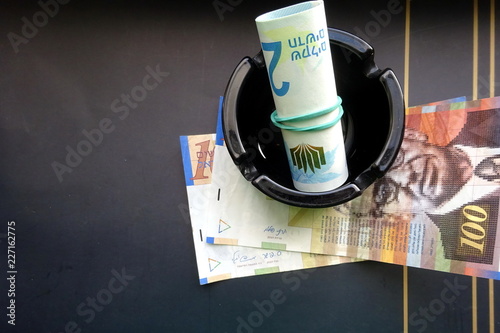 Israeli money - 100 (one hundred) new shekels bill, roll of 200 shekels bills