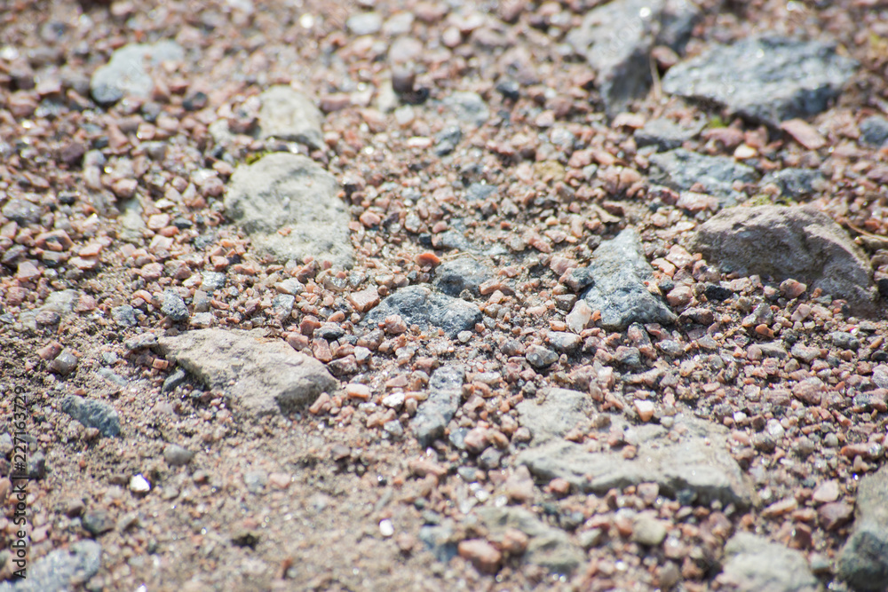 Background of a road of small pebbles and stones, close Background of a road of small pebbles and stones, close