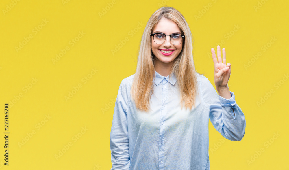 Young beautiful blonde business woman wearing glasses over isolated background showing and pointing up with fingers number three while smiling confident and happy. Young beautiful blonde business woman wearing glasses over isolated background showing and pointing up with fingers number three while smiling confident and happy.