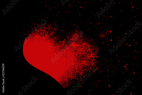 RED BROKEN HEART ON BLACK BACKGROUND photo