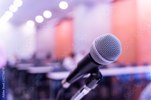 Microphone over the blurred business forum Meeting or Conference Training Learning Coaching Room Concept, Blurred background.