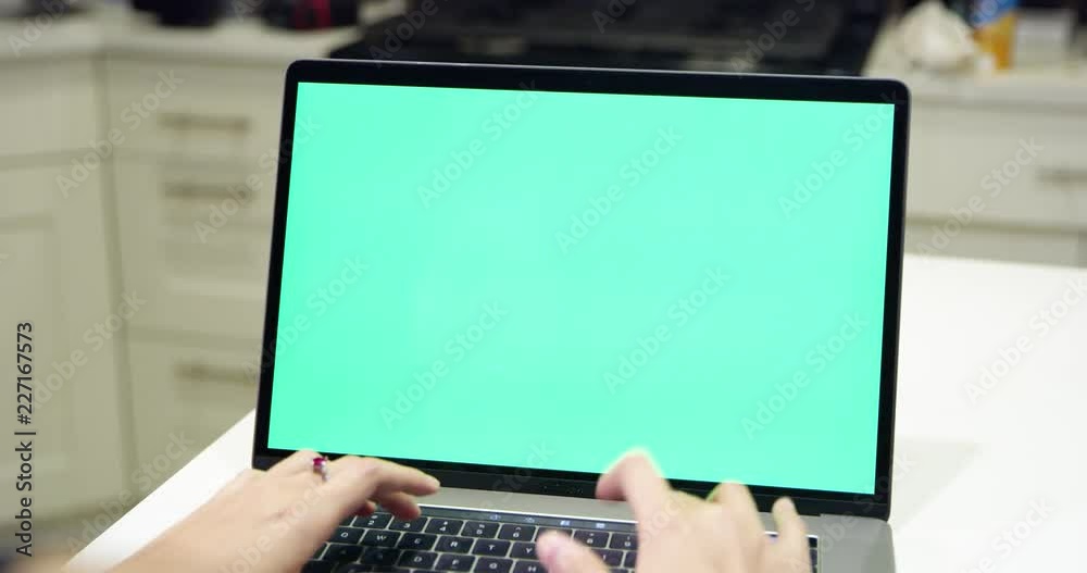 Woman using green screen laptop Woman using green screen laptop