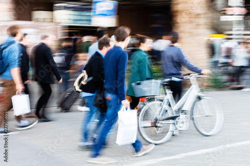 commuters in motion blur on the move in the city
