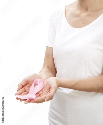 Woman holding a pink ribbon.
