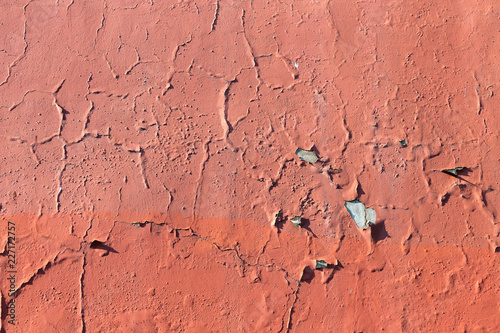 Cracked peeling swollen texture on Old painted wall.