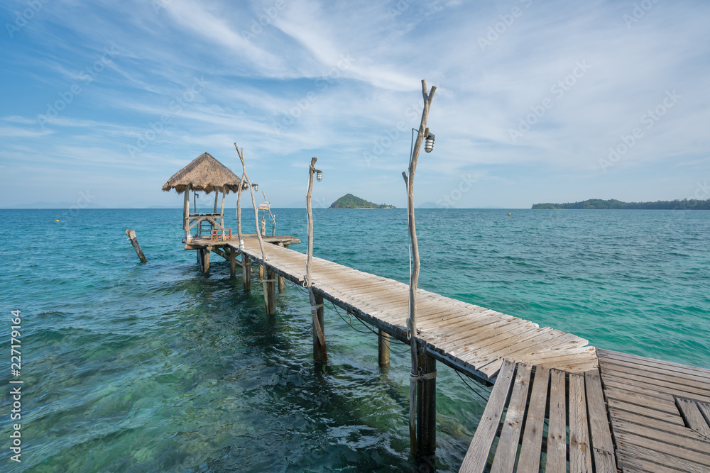 Wooden pier with hut in Phuket, Thailand. Summer, Travel, Vacation and Holiday concept. Wooden pier with hut in Phuket, Thailand. Summer, Travel, Vacation and Holiday concept.