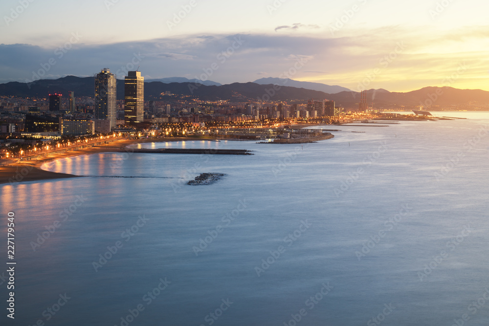 Aerial view of Barcelona Beach in summer night along seaside in Barcelona, Spain. Mediterranean Sea in Spain.