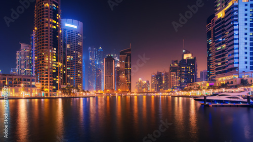 Beautiful view to Dubai Marina, UAE. City skyline. Long exposure time lapse effect at night