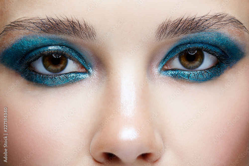 Closeup macro portrait of female face. Woman with evening beauty makeup