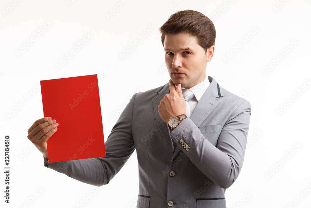 Businessman showing signboard. In studio on a white background Businessman showing signboard. In studio on a white background