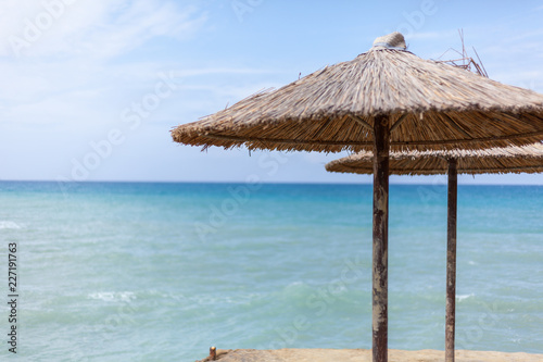 Fototapeta Naklejka Na Ścianę i Meble -  Design business concept Business ad for website promotion banners empty social media ad. Blue beach water Thatched Straw Umbrellas Message Ideas Thoughts Reflection