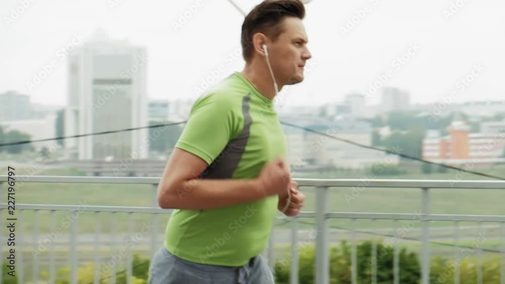 Young athlete runner in the city super slow motion Young athlete runner in the city super slow motion