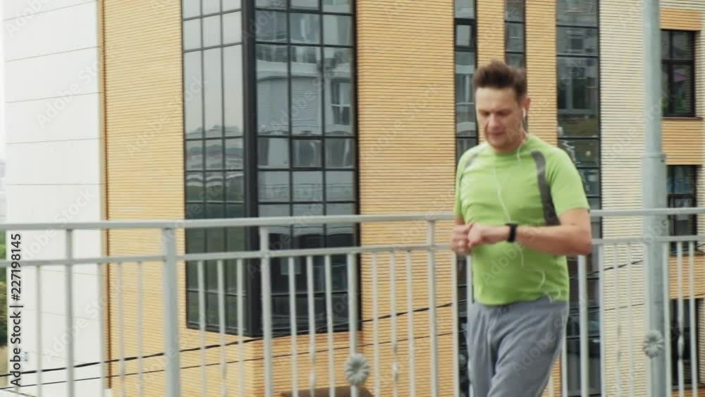 Young athlete runner in the city super slow motion Young athlete runner in the city super slow motion