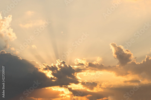 Evening sky with rays from behind the clouds. Sunlight coming from behind the clouds