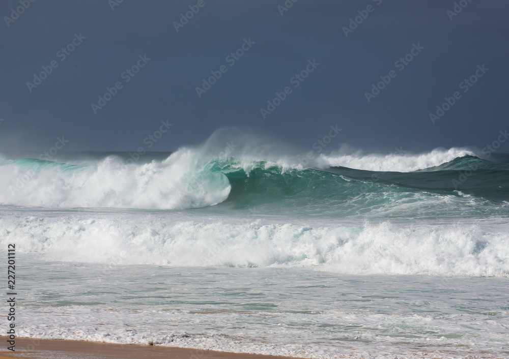 Fototapeta premium Large waves breaking on the beach