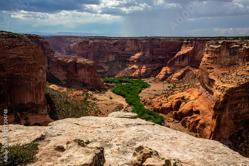 Canyon de Chelly from Spider Rock Point looking west at gathering monsoon storms. Canyon de Chelly National Monument in northeast Arizona.