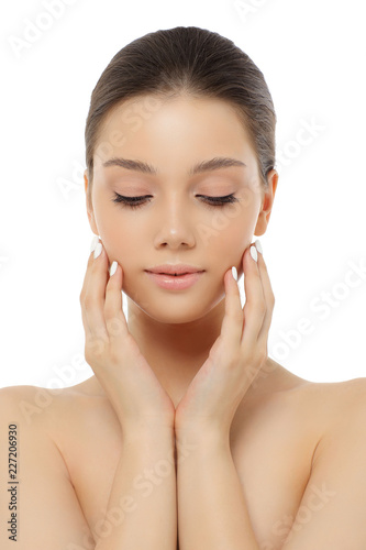 Portrait of a beautiful young woman, skin care and hands with manicure