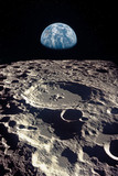 Earth rises above lunar horizon. Elements of this image furnished by NASA.