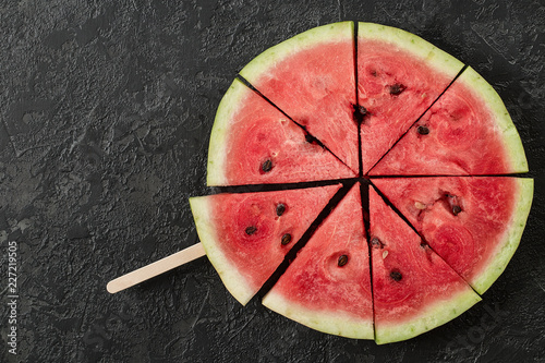 Watermelon Slice on Dark Stone Table. Summer Background.