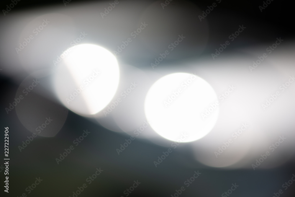 Abtract blured bokeh of light reflected from car