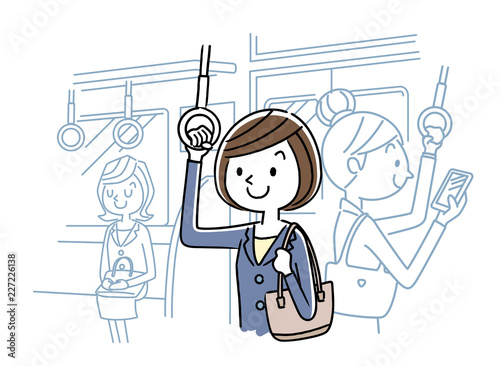 電車で通勤する女性

