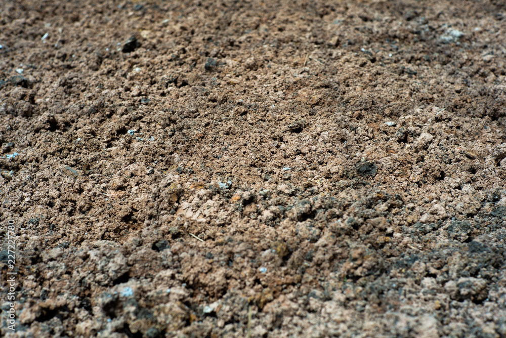 Abstract background and texture of .lateritic soil with the shadow of steel structure on the ground at construction site Abstract background and texture of .lateritic soil with the shadow of steel structure on the ground at construction site