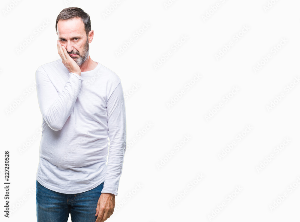 Middle age hoary senior man wearing white t-shirt over isolated background thinking looking tired and bored with depression problems with crossed arms. Middle age hoary senior man wearing white t-shirt over isolated background thinking looking tired and bored with depression problems with crossed arms.