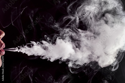 close-up lips releasing vape smoke (e-cigarette) background image with space for text