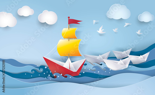 Red and white sailing boat in the ocean