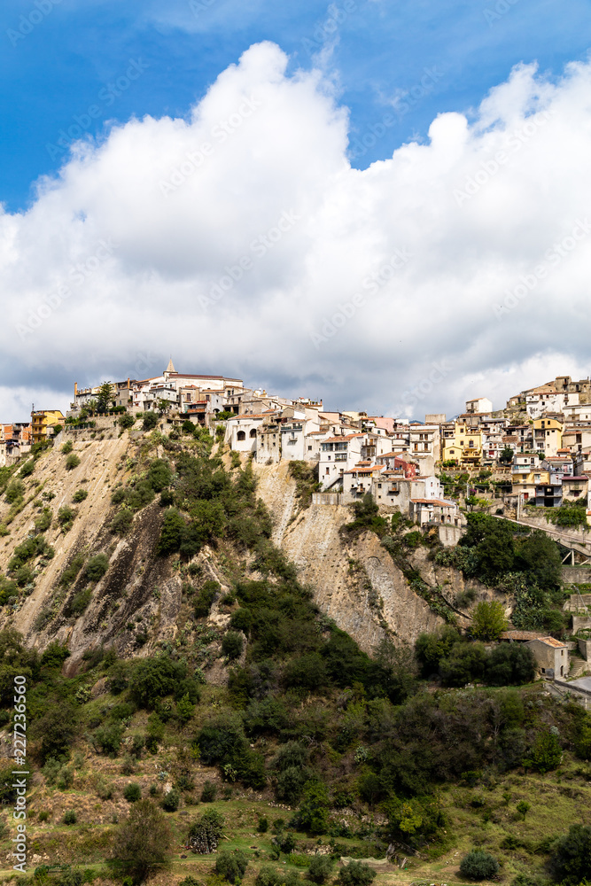 View of Motta Camastra, a village in Sicily not far from Taormina, perched on the top of a hill in the valley of the Alcantara River
