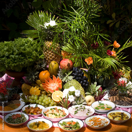 Table full of fruit, vegetalbes and vegetarian ayurvedic meals, food for d-tox and balancing doshas photo