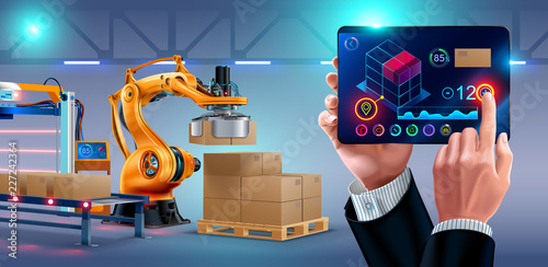Automation of warehouse on smart factory, the robotic arm loading boxes on pallets. The application on the tablet manages the logistics of the plant. businessman holding a tablet