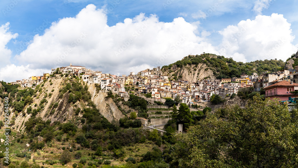 Panoramic view of Motta Camastra, a village in Sicily not far from Taormina, perched on the top of a hill in the valley of the Alcantara River